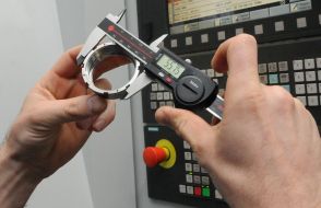 Worker measures the detail