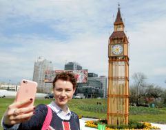 The girl photographed on a background of art song "Big Ben"