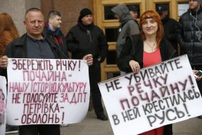 Participants of the rally held up signs