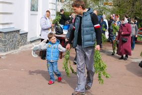 People are carrying sprigs of willow