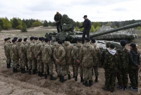 Students examine the T-72 tank
