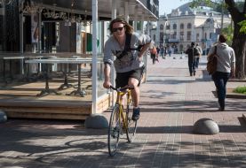 A young man riding a bicycle