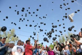 People launching black balls