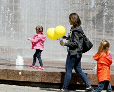 Girl runs at the fountain