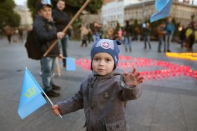 The boy with the flag of the Crimean Tatars