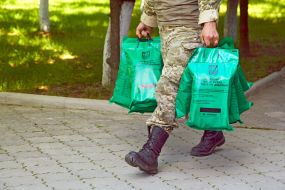 A soldier carries rations