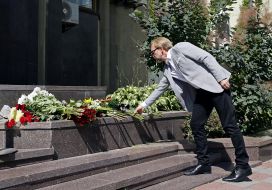 The man brought flowers to the French Embassy