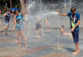 People pour water on each other