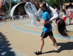 People pour water on each other