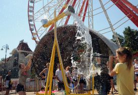 People pour water on each other