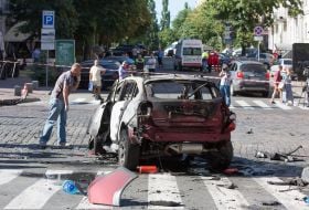 Police officers on site car explosion