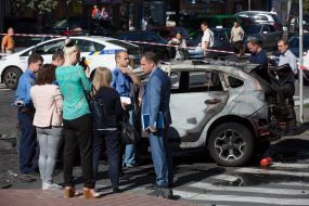 Police officers on site car explosion