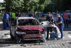 Police officers on site car explosion