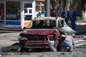 Police officers on site car explosion