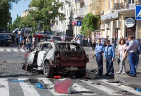 Police officers on site car explosion