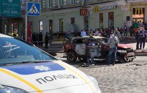 Police officers on site car explosion