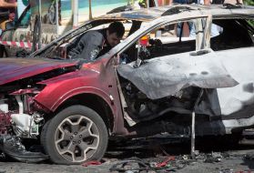 Police officers on site car explosion