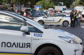 Police officers on site car explosion