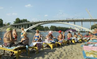 People relax on the beach