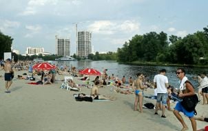 People relax on the beach