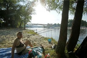 People relax on the beach