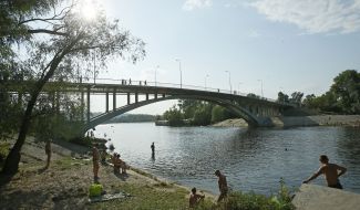 People relax on the beach