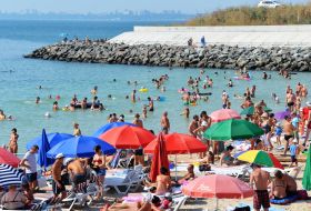 People relax on the beach
