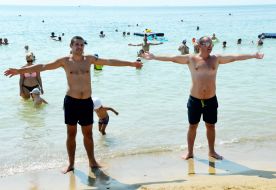 People relax on the beach