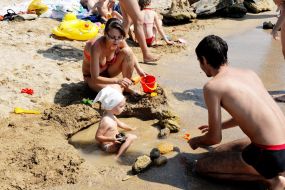 People relax on the beach