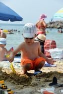 A child plays on the beach