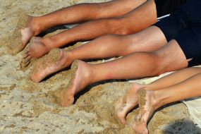 People relax on the beach