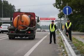 Employees patrol at the entrance to Kiev