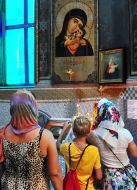 Believers light candles