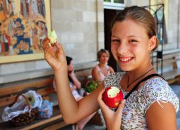 Girl eats an apple