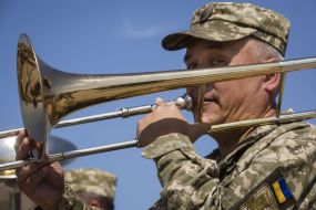 A soldier plays the trombone