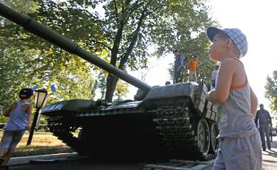 Children playing near the tank 
