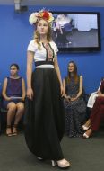 A model demonstrates a dress