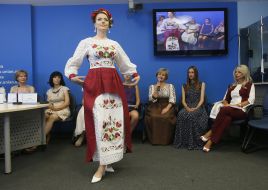 A model demonstrates a dress