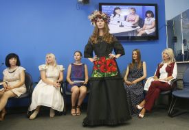 A model demonstrates a dress