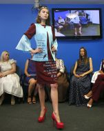 A model demonstrates a dress