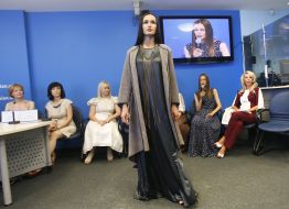 A model demonstrates a dress