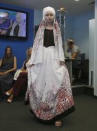 A model demonstrates a dress