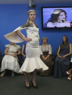 A model demonstrates a dress
