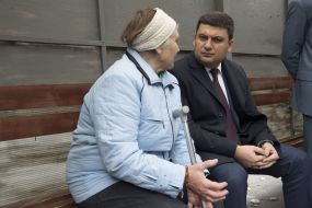 Vladimir Groisman with elderly woman