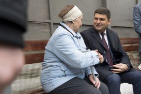 Vladimir Groisman with elderly woman