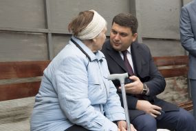 Vladimir Groisman with elderly woman