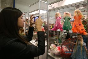 Girl photographs of dolls