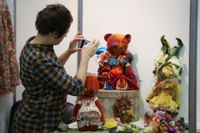 Girl photographs of dolls