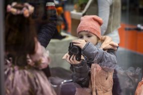 Girl photographs of dolls