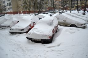 Cars covered with snow